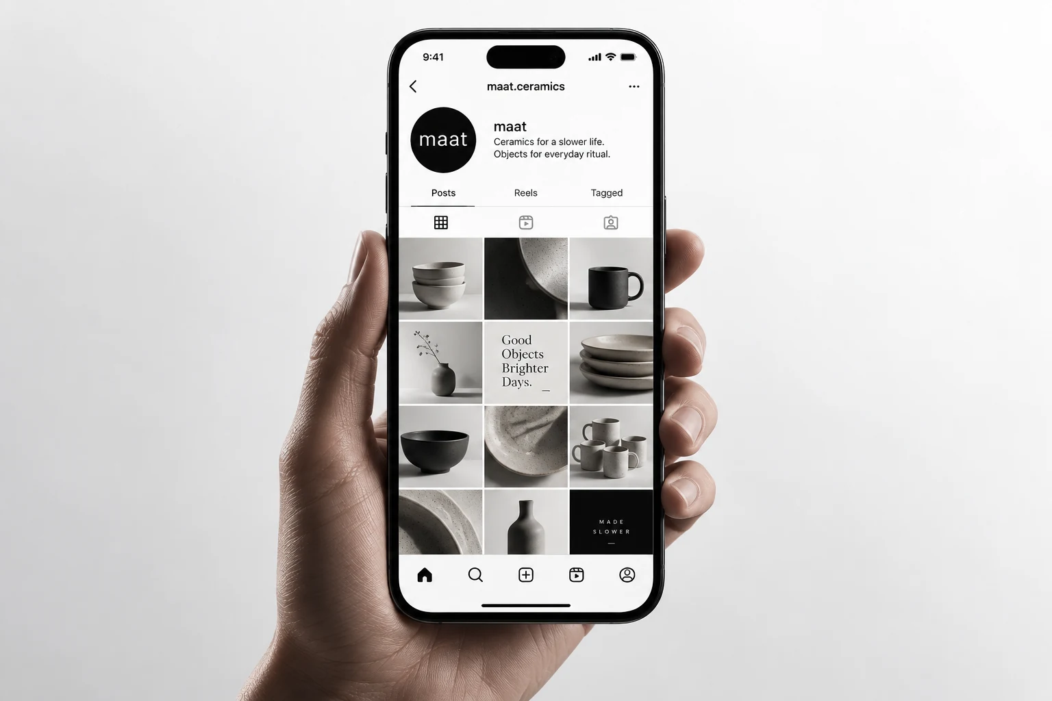 Phone displaying a curated ceramics social media feed